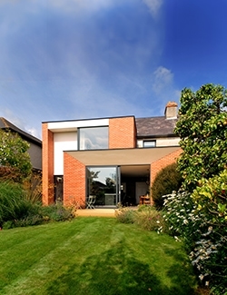 A classic home in South Dublin with a modern two-storey extension carefully design by Architects to opens onto a lush garden