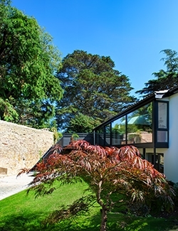 Stylish house refurbishment project in Blackrock,  Dublin set against a backdrop of greenery and clear skies